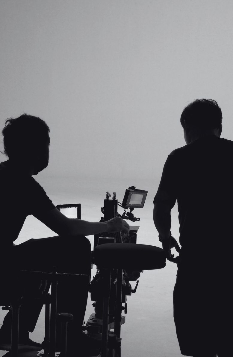 Visual Triangle crew operating a camera rig on set